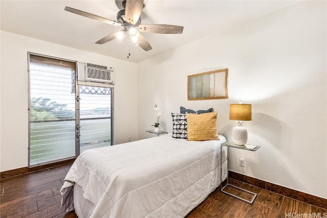 bedroom featuring access to exterior, a wall unit AC, dark hardwood / wood-style floors, and ceiling fan