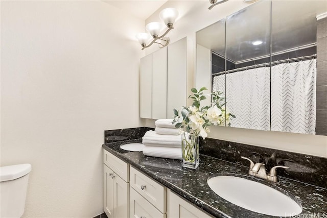 bathroom with vanity, a shower with curtain, and toilet