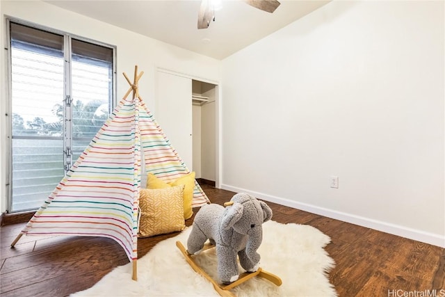 sitting room featuring hardwood / wood-style flooring and ceiling fan