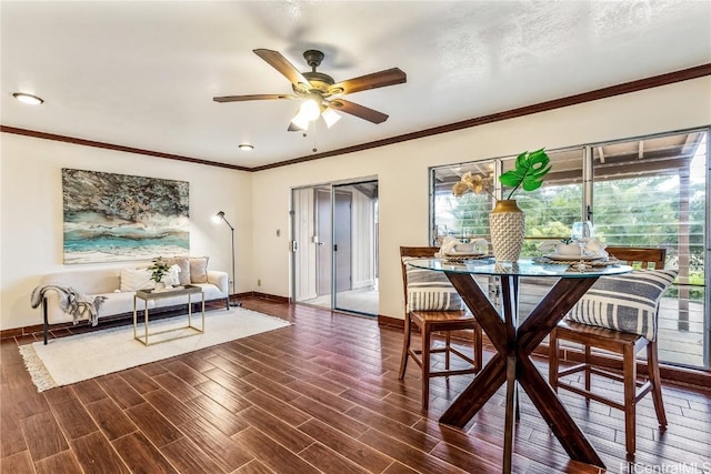 dining room featuring ornamental molding, dark hardwood / wood-style floors, and ceiling fan