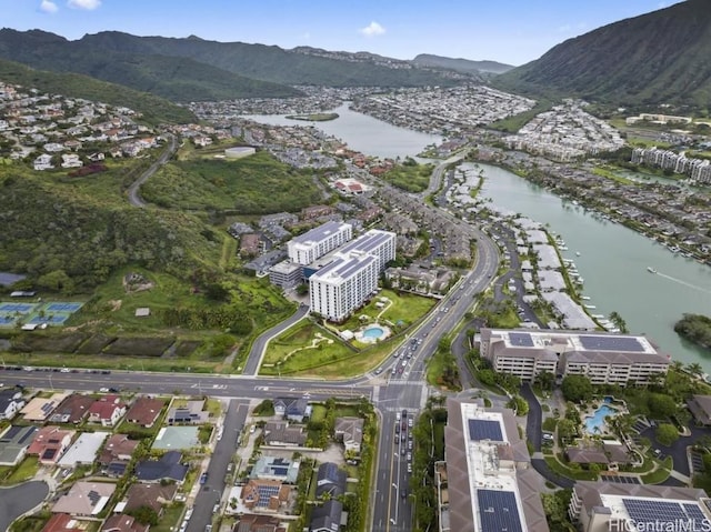 drone / aerial view featuring a water and mountain view