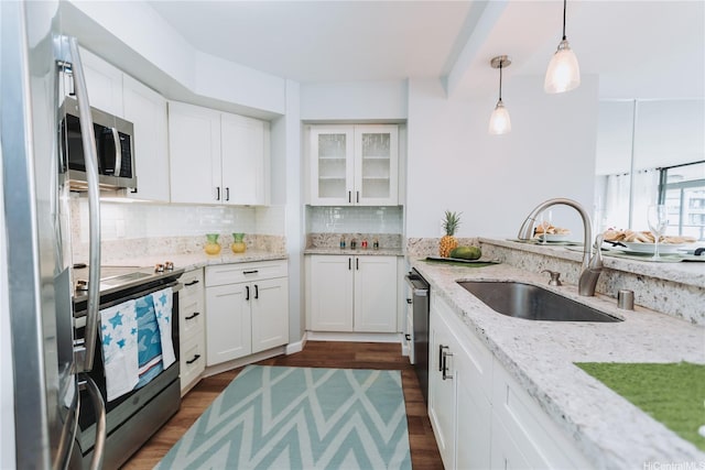583 Kamoku St Unit 1907, Honolulu, HI 96826 - kitchen with stainless steel appliances, a sink, backsplash, and white cabinetry