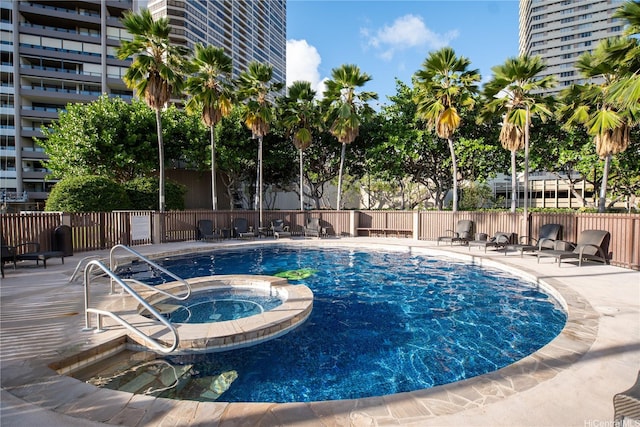 583 Kamoku St Unit 1907, Honolulu, HI 96826 - view of pool with a pool with connected hot tub and a patio area