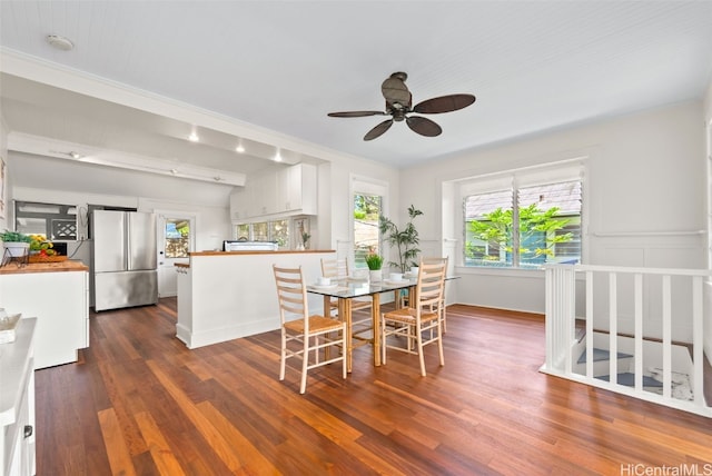 dining area featuring dark hardwood / wood-style floors and ceiling fan