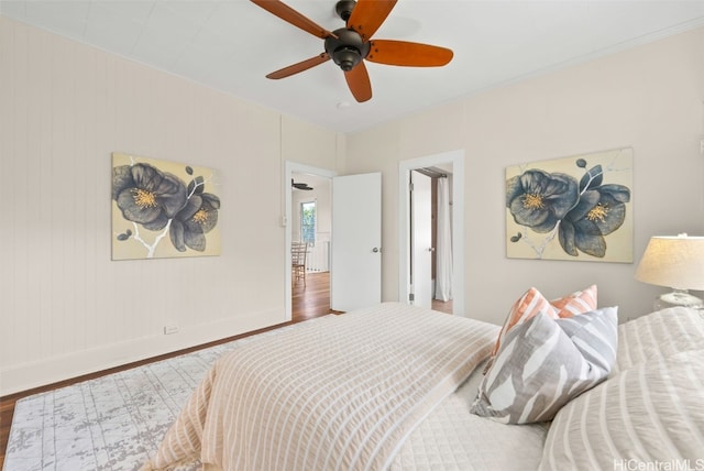 bedroom with hardwood / wood-style floors and ceiling fan