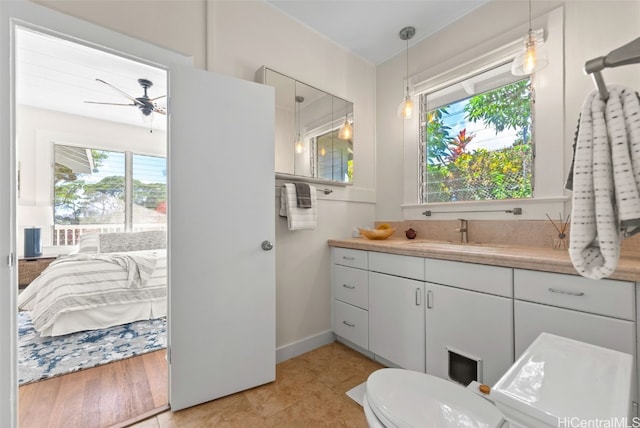 bathroom with vanity, tile patterned floors, and ceiling fan