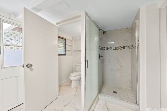 bathroom with toilet and a tile shower