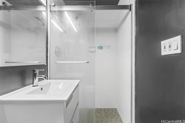 bathroom with vanity and an enclosed shower