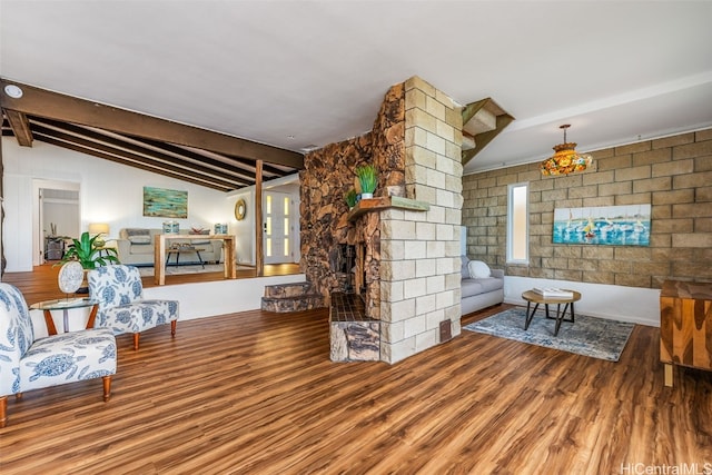 living room featuring vaulted ceiling with beams and hardwood / wood-style floors