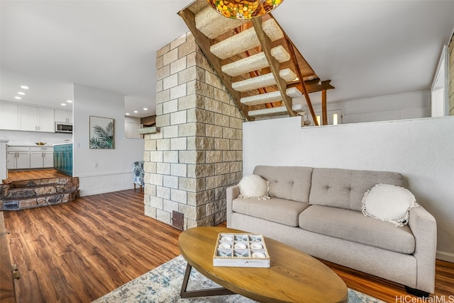 living room featuring dark wood-type flooring