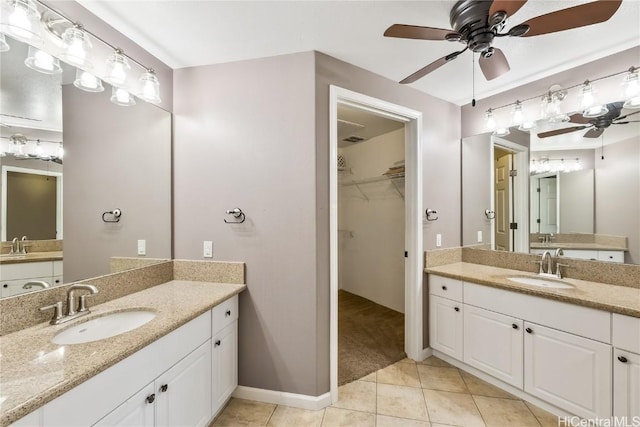 bathroom with ceiling fan, vanity, and tile patterned flooring