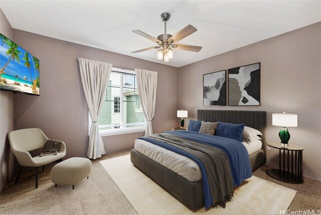 bedroom featuring light carpet and ceiling fan