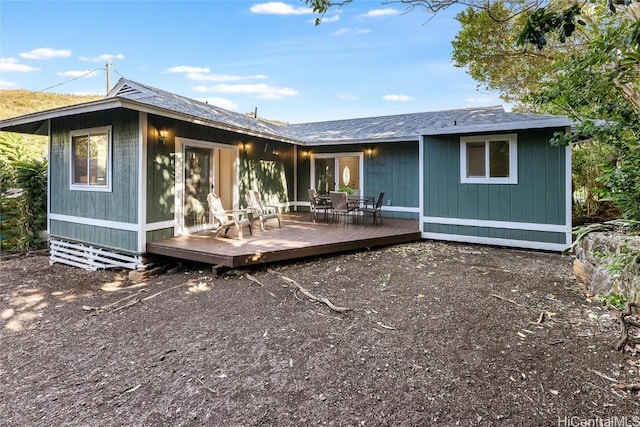 back of house with a wooden deck