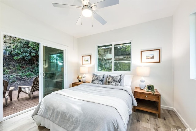 bedroom featuring ceiling fan, light wood-type flooring, and access to outside