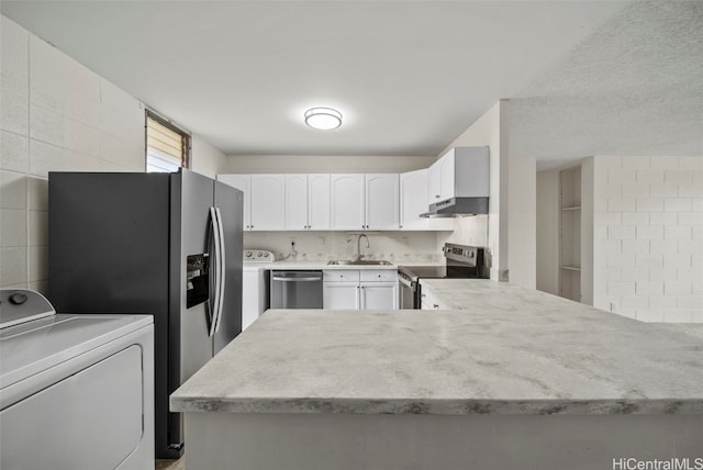 kitchen with white cabinetry, appliances with stainless steel finishes, sink, and decorative backsplash