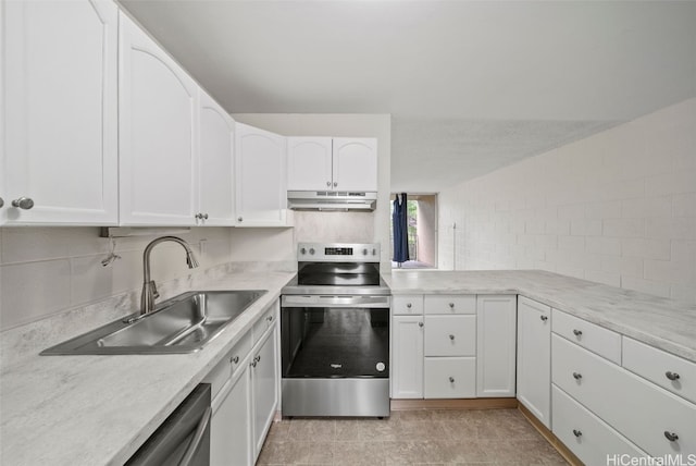 kitchen featuring sink, backsplash, white cabinets, and appliances with stainless steel finishes