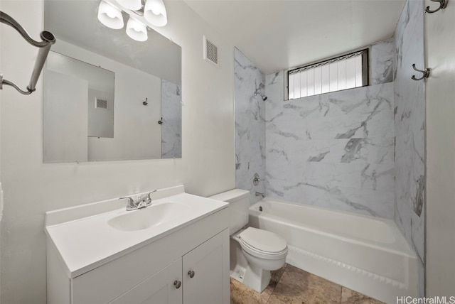 full bathroom featuring tiled shower / bath, vanity, and toilet