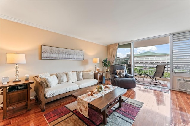 living room featuring hardwood / wood-style flooring and a wall of windows