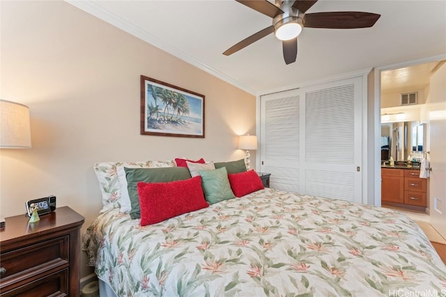 bedroom featuring crown molding, connected bathroom, ceiling fan, and a closet