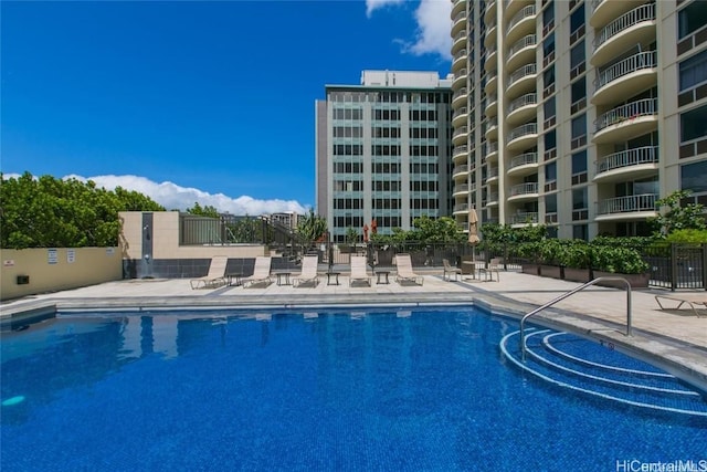 view of swimming pool with a patio