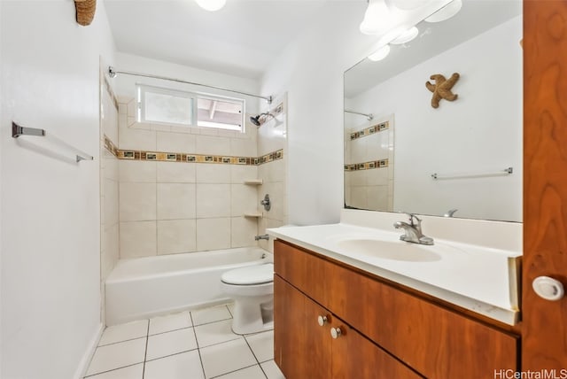 full bathroom with vanity, tiled shower / bath combo, tile patterned floors, and toilet