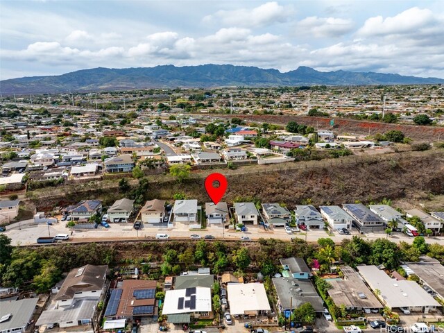 birds eye view of property featuring a mountain view