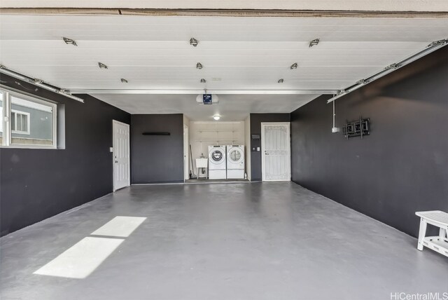 garage featuring a garage door opener and washing machine and dryer