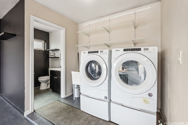 clothes washing area featuring washing machine and dryer