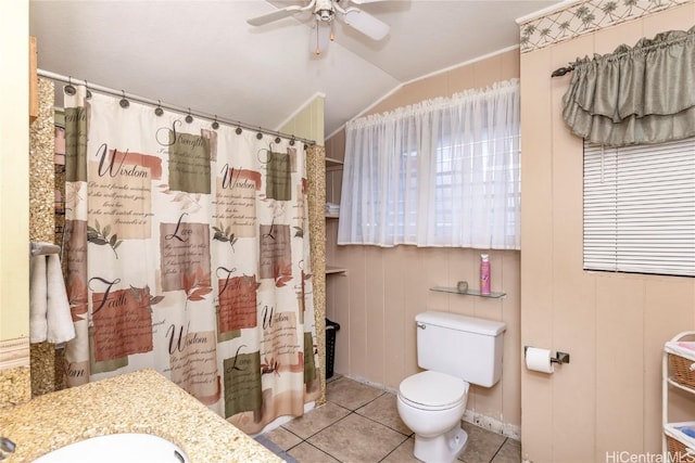 bathroom featuring vaulted ceiling, tile patterned flooring, ceiling fan, walk in shower, and toilet