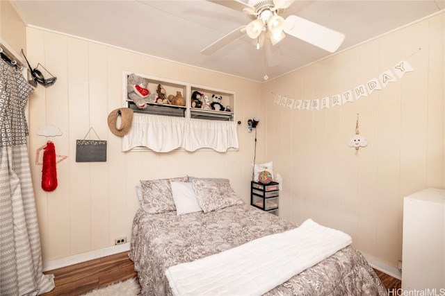 bedroom featuring wood-type flooring and ceiling fan