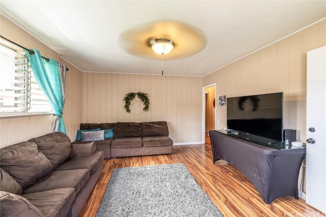 living room featuring ceiling fan and light hardwood / wood-style floors