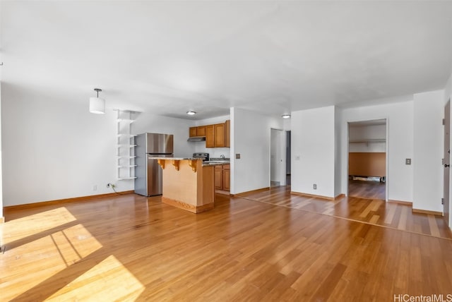 unfurnished living room with light wood-type flooring