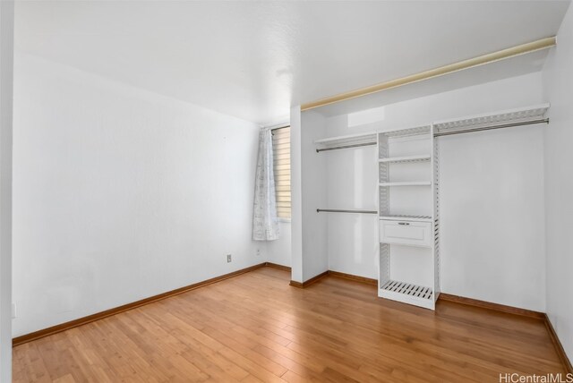 unfurnished bedroom with wood-type flooring