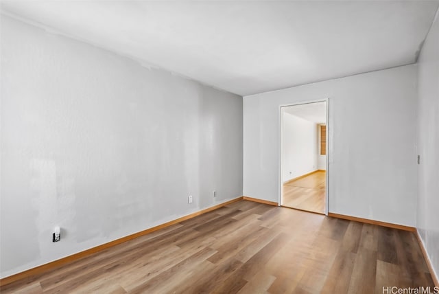 unfurnished room featuring hardwood / wood-style flooring