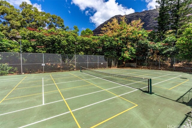 view of sport court with a mountain view