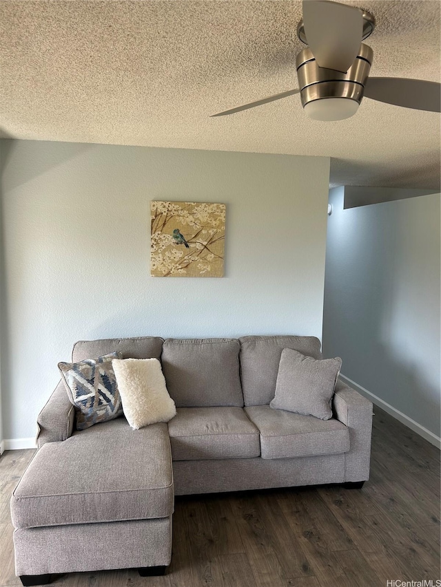 94-1139 Mopua Loop Unit J8, Waipahu, HI 96797 - living area with wood finished floors, baseboards, and a textured ceiling