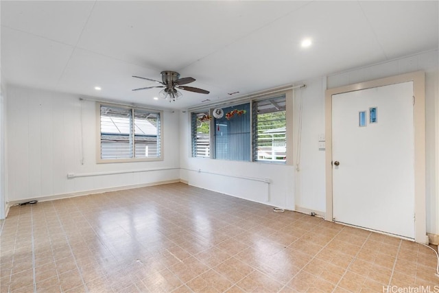 entryway with a wealth of natural light and ceiling fan