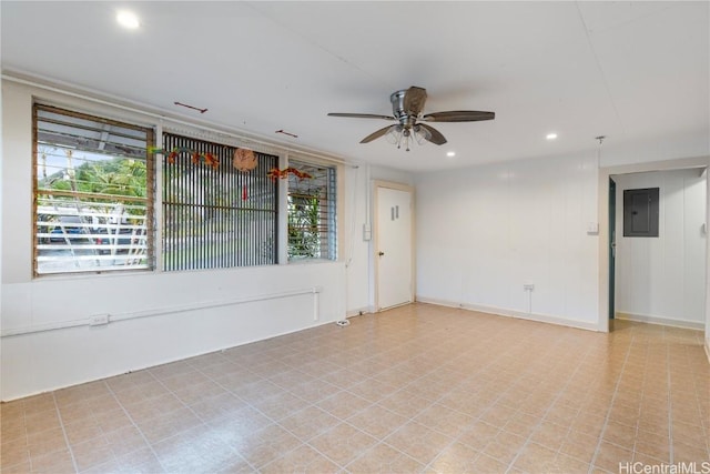 empty room with ceiling fan and electric panel