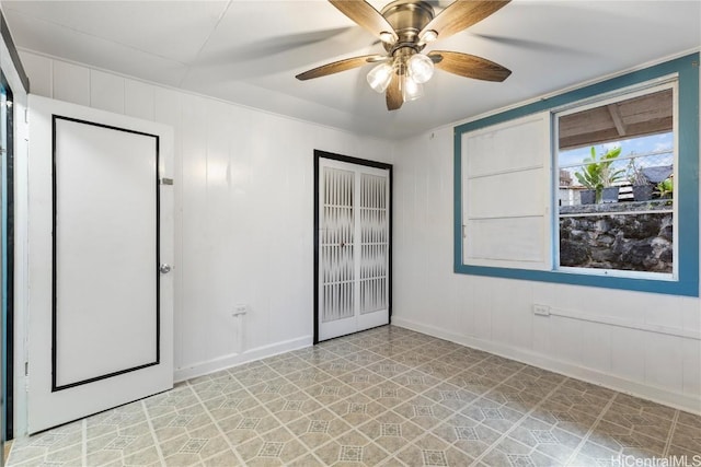 unfurnished bedroom featuring ceiling fan