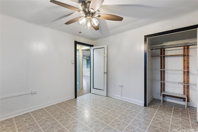 unfurnished bedroom featuring ceiling fan