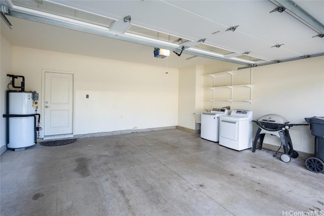 garage featuring a garage door opener, gas water heater, and separate washer and dryer