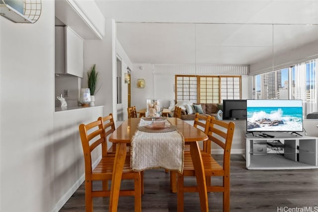 dining area featuring dark hardwood / wood-style floors