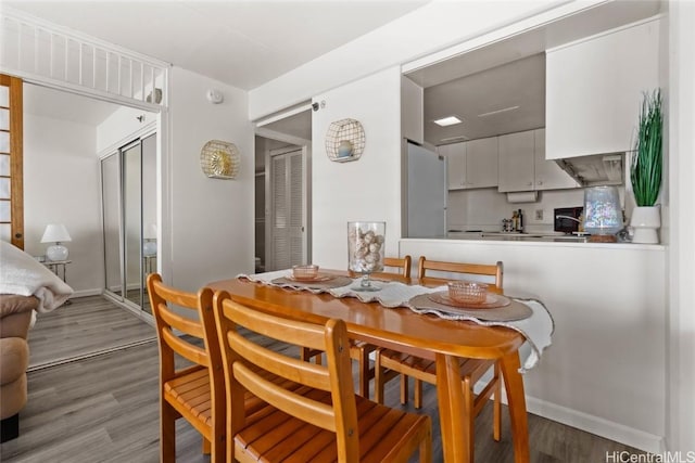 dining room featuring hardwood / wood-style flooring