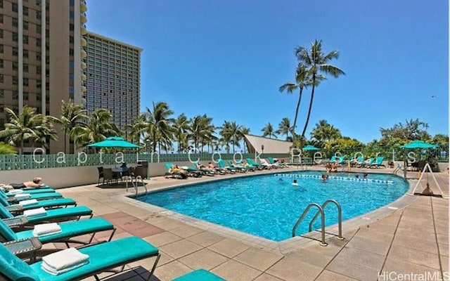 view of swimming pool featuring a patio area