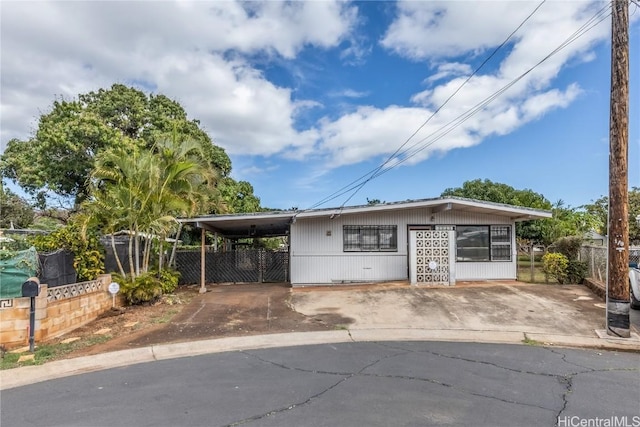 view of front of home featuring a carport