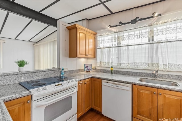 kitchen with lofted ceiling with beams, white appliances, and sink