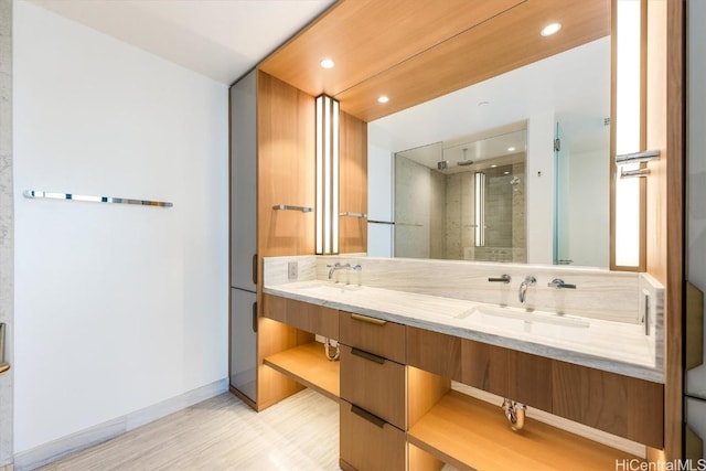 bathroom featuring vanity and a shower with shower door