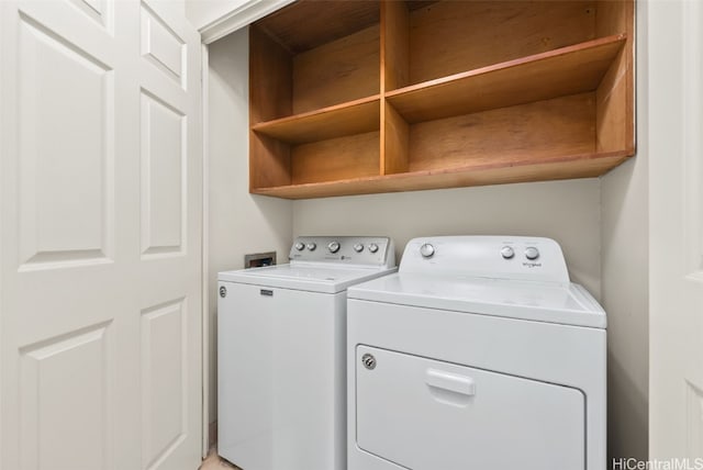 washroom featuring washer and clothes dryer