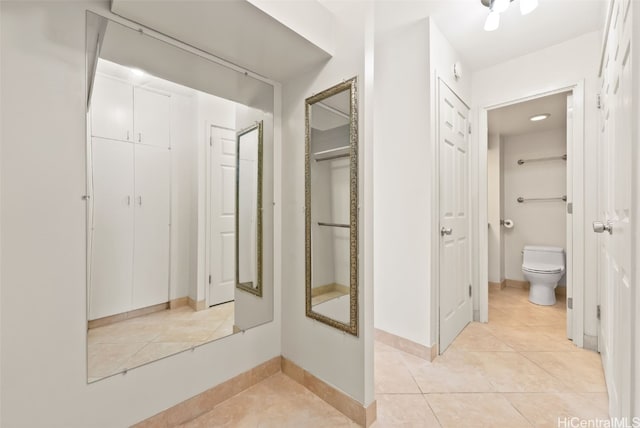 bathroom with tile patterned floors and toilet