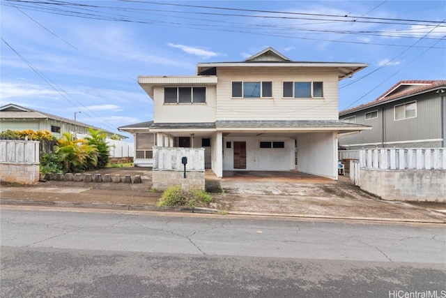 view of front of house with a carport